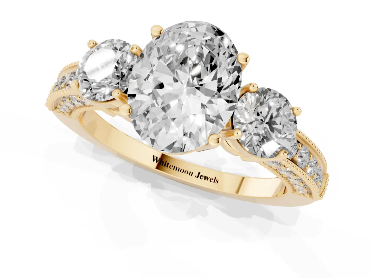 Oval Cut Three-Stone Diamond Ring with Pavé Band and Four-Prong Setting Yellow gold