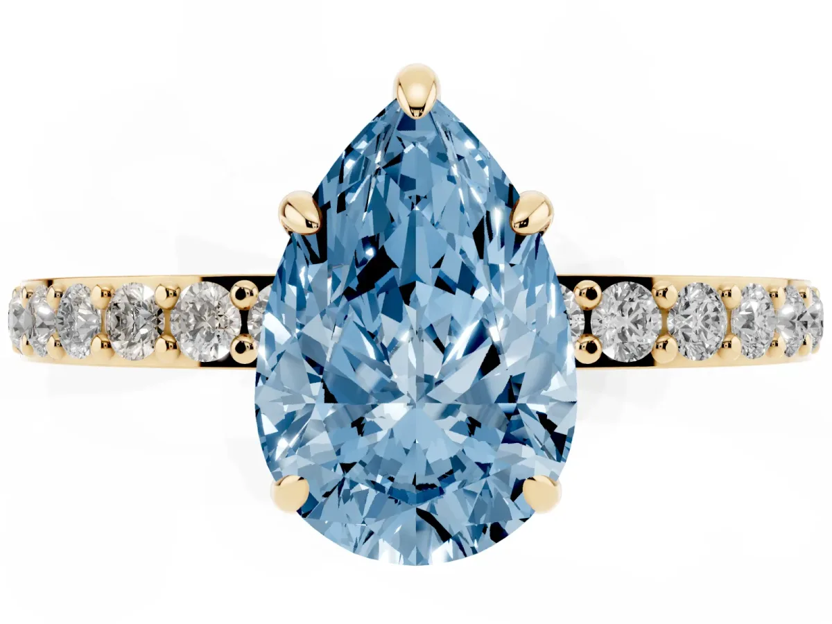 Fancy Blue Pear Cut Diamond Pavé Engagement Ring with Round Accents and Prong Setting Yellow gold