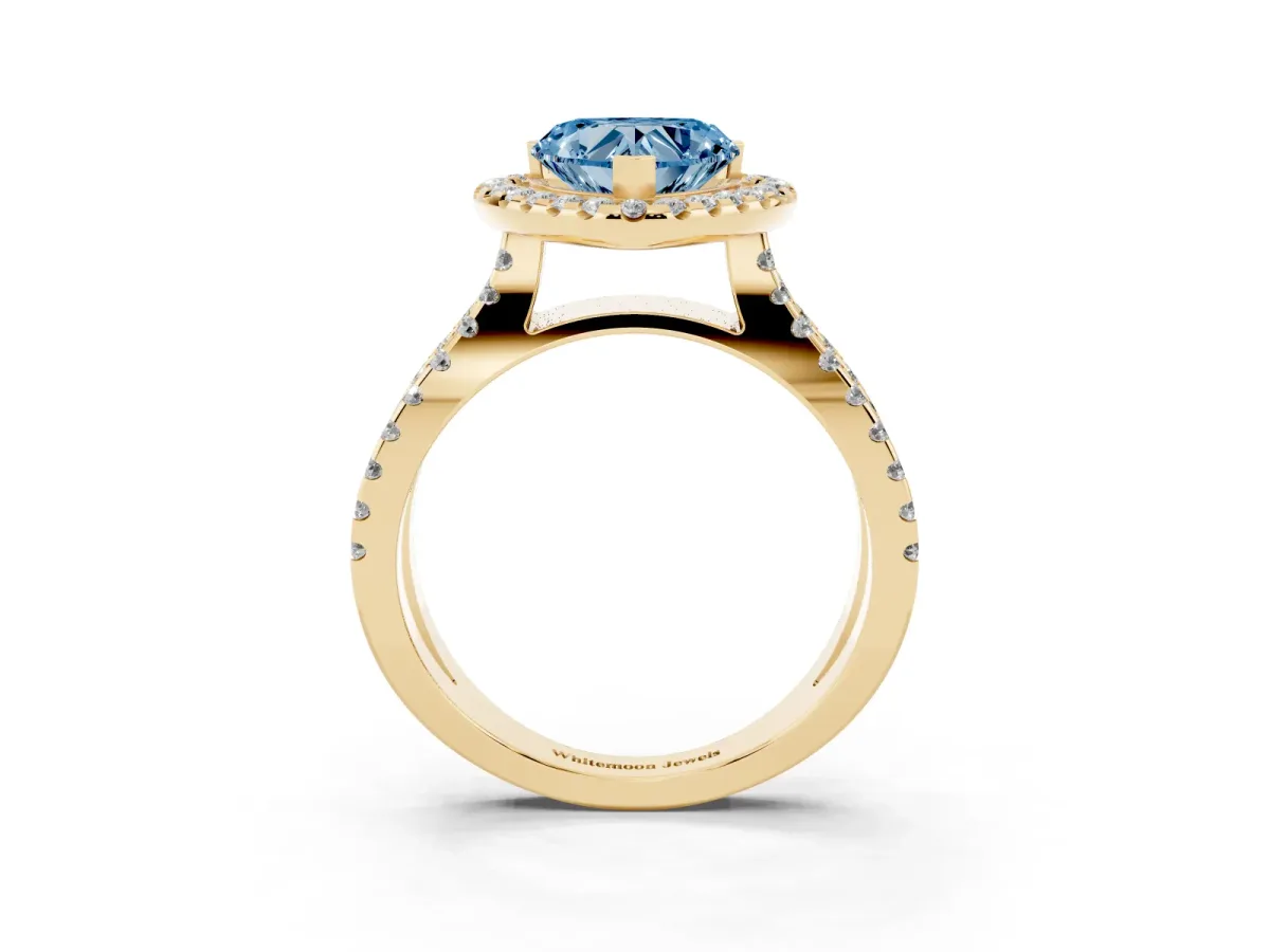Fancy Blue Heart Cut Diamond Halo Ring with Split Shank Pavé Band and Prong Setting Yellow gold