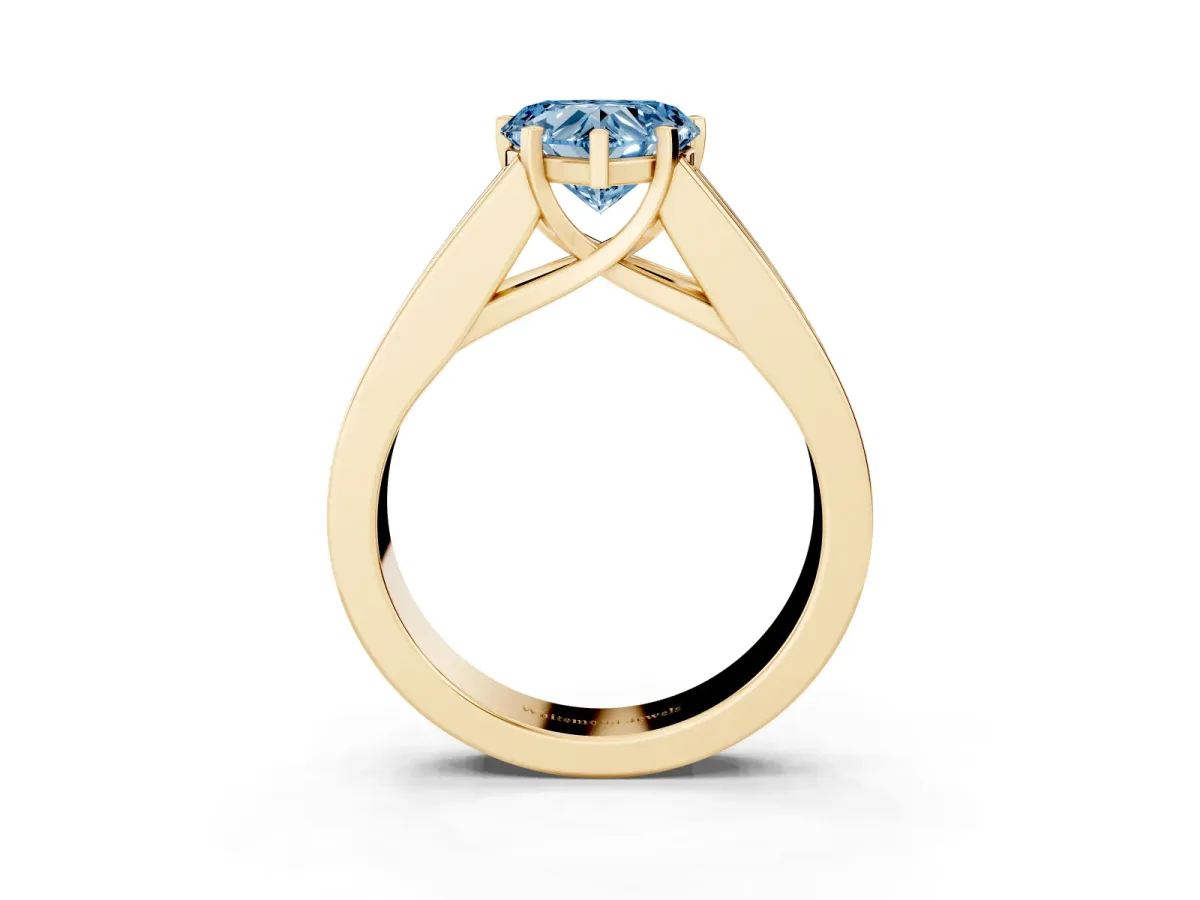 Fancy Blue Heart Cut Cut Channel Set Solitaire Ring with Four-Prong Setting Yellow gold