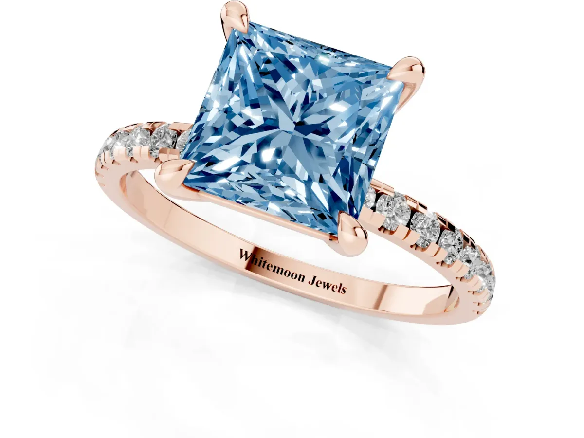 Fancy Blue Princess Cut Diamond Brilliant Solitaire Ring with Pavé Band and Four-Prong Setting Rose gold