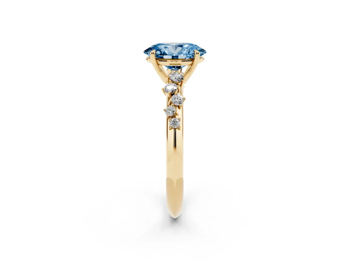 Fancy Blue Oval Cut Diamond Cluster Side Stone Solitaire Ring with Prong Setting Yellow gold