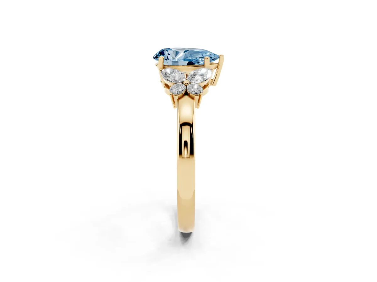 Fancy Blue Pear Cut Cut Solitaire Floral Diamond Ring with Four-Prong Setting Yellow gold