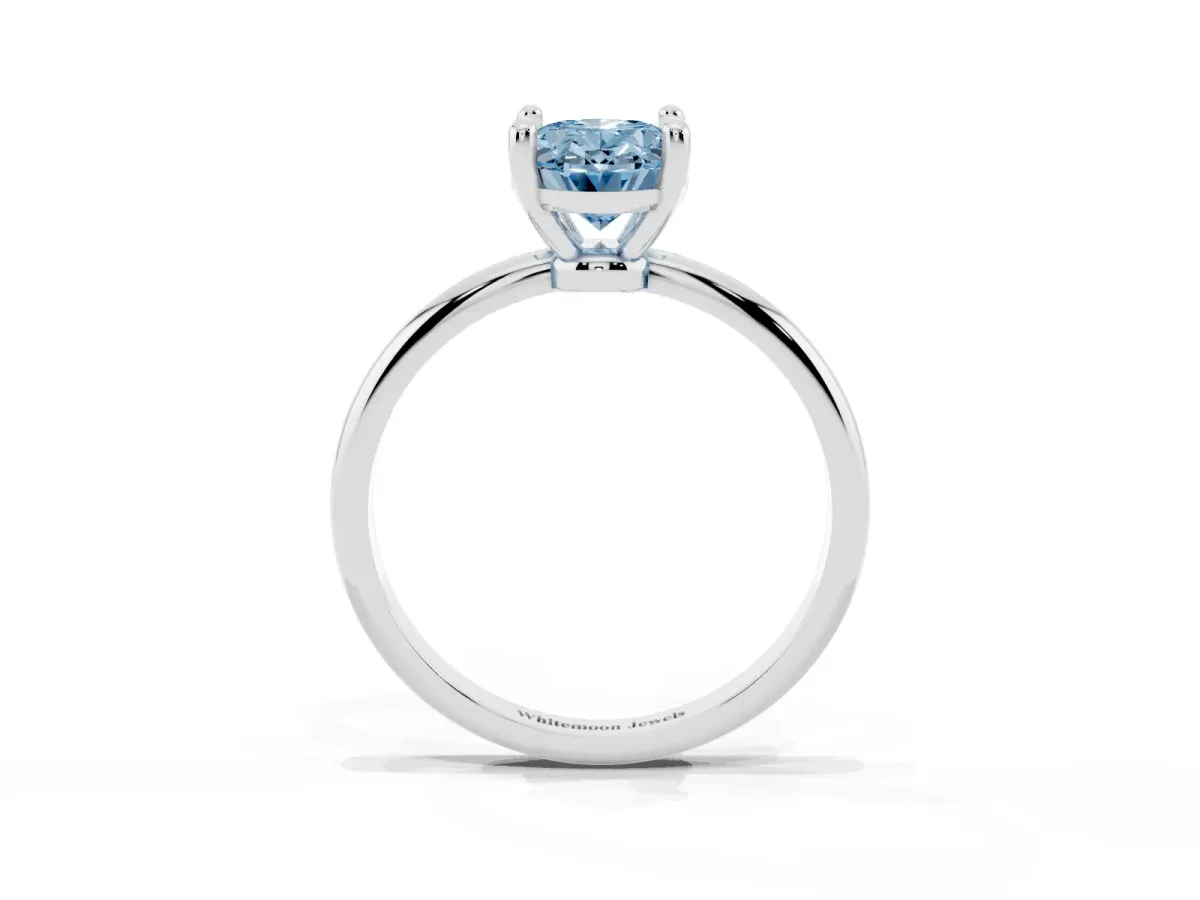 Fancy Blue Oval Cut Solitaire Diamond Ring with 4-Prong Setting on a Classic Band Silver
