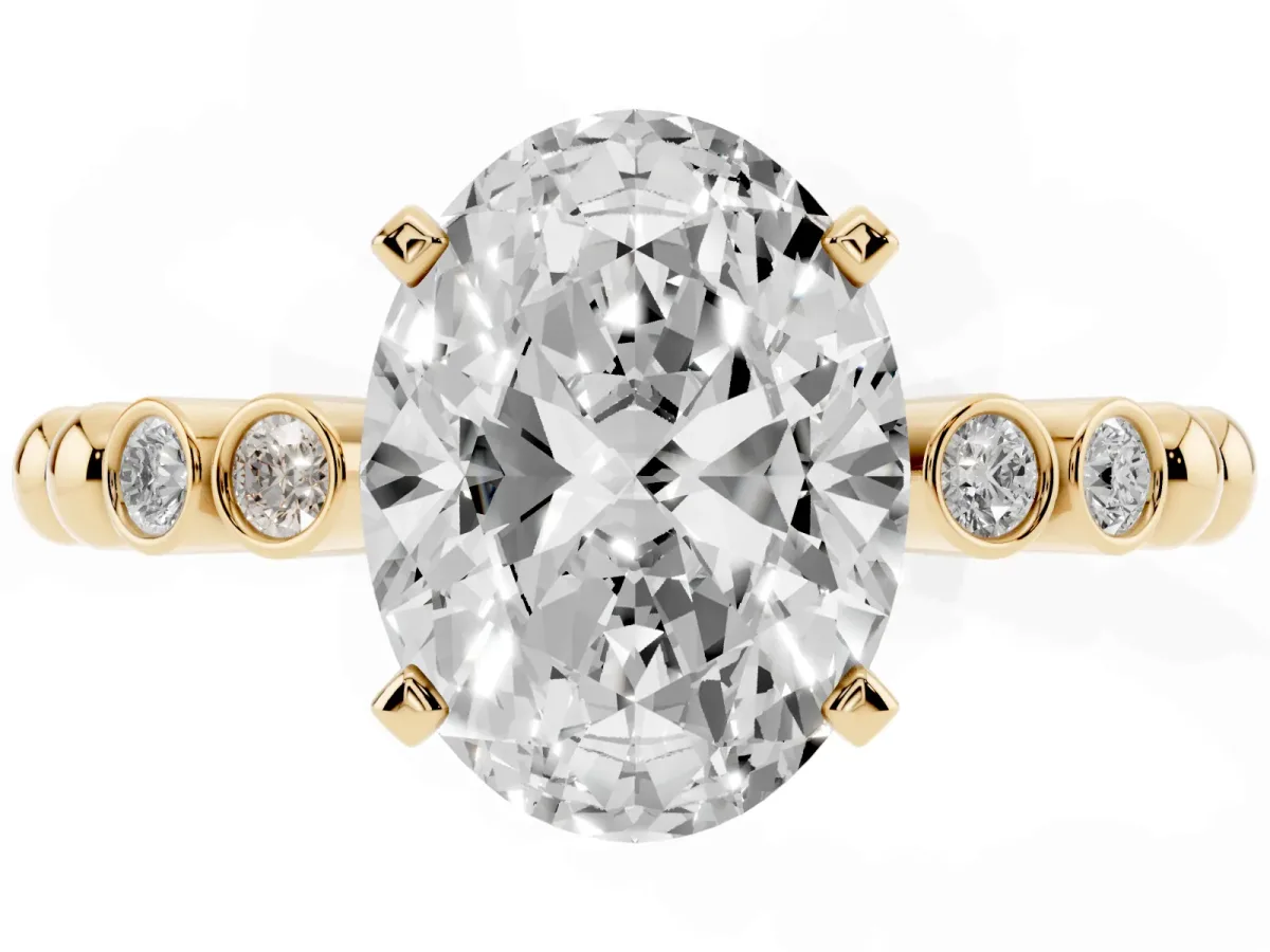 Oval Cut Solitaire Bezel Accent Diamond Engagement Ring with Beaded Band and Four-Prong Setting Yellow gold