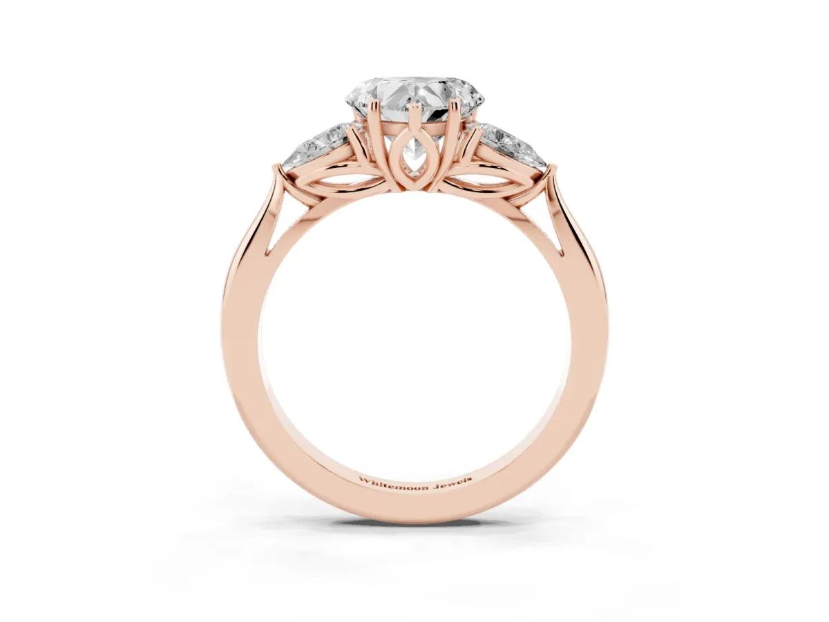 Three-Stone Heart Cut Diamond Ring with Pear Side Stones in Four-Prong Setting Rose gold
