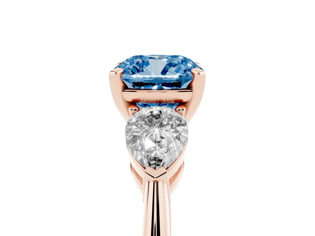 Fancy Blue Three-Stone Cushion Cut Diamond Ring with Pear Side Stones and Four-Prong Setting Rose gold