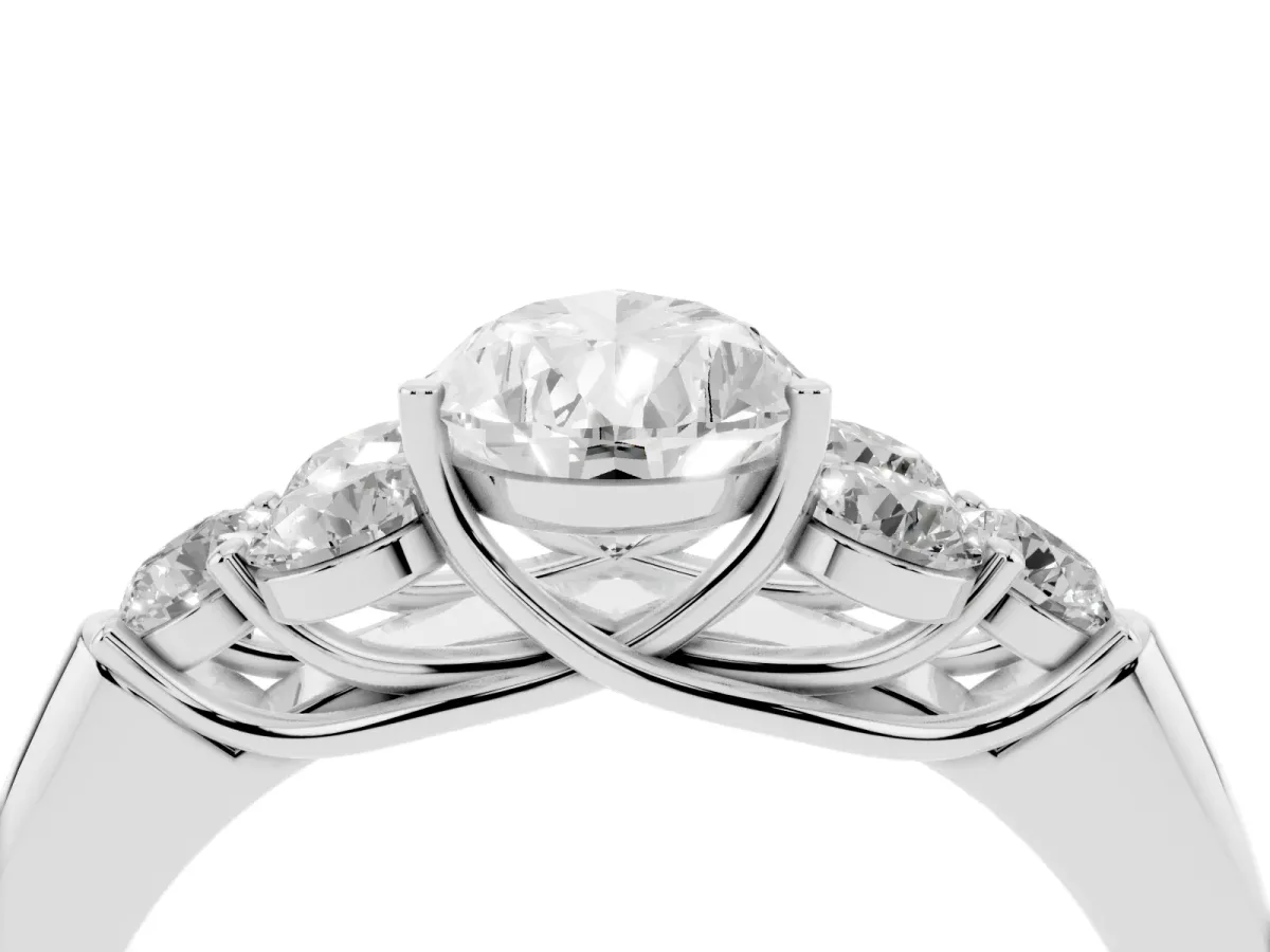 Pear Cut Cut Diamond Cluster Ring with Round Accent Stones and Prong Setting on a Classic Band White gold