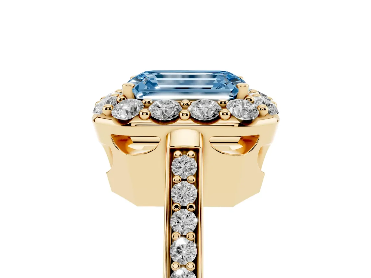 Fancy Blue Emerald Cut Diamond Floral Halo Ring with Pavé Band and Prong Setting Yellow gold