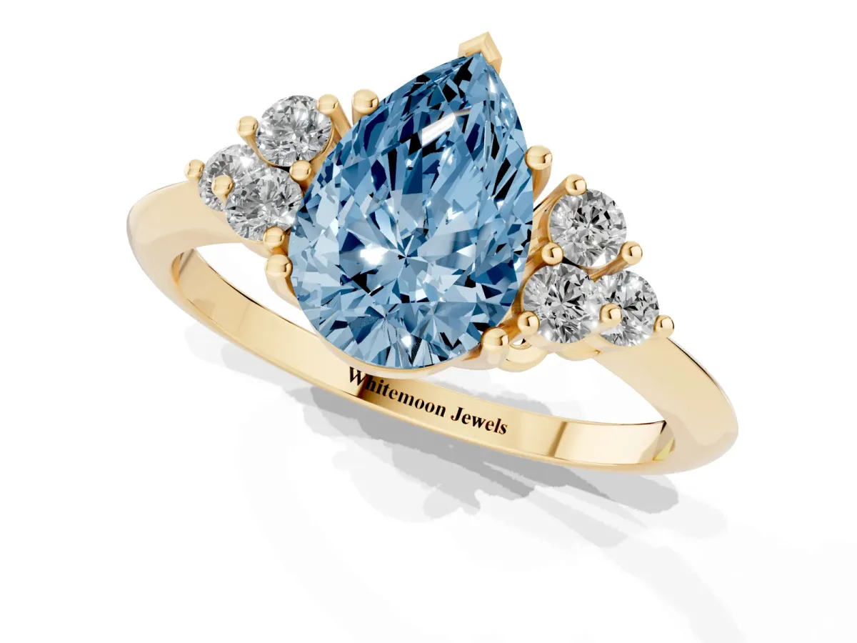 Fancy Blue Pear Cut Cut Diamond Cluster Ring with Solitaire Band and Four-Prong Setting Yellow gold