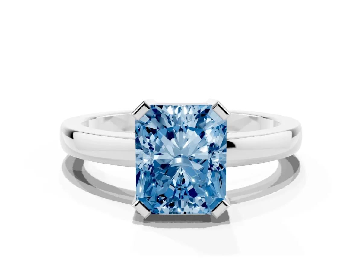 Fancy Blue Radiant Cut Cut Solitaire Ring with Four-Prong Setting and Classic Band Silver