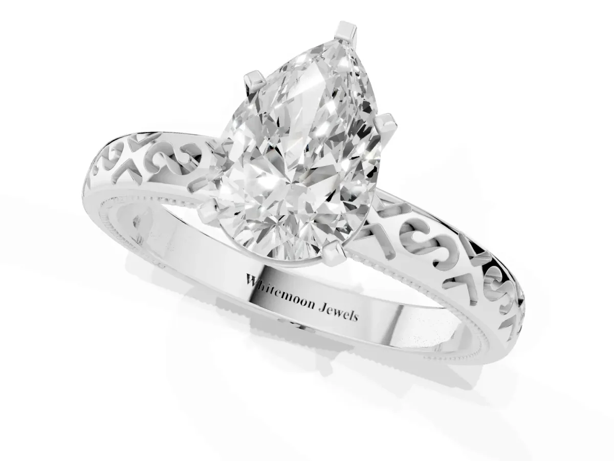 Pear Cut Solitaire Engagement Ring with Scrollwork Band and Four-Prong Setting White gold