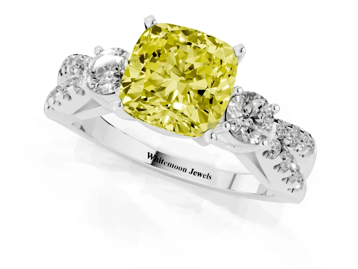 Fancy Yellow Cushion Cut Diamond Three-Stone Ring with Pavé Split Shank and Four-Prong Setting Platinum