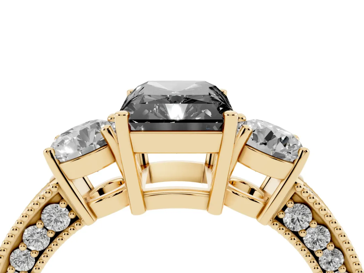 Fancy Black Radiant Cut Three-Stone Diamond Ring with Pavé Band and Four-Prong Setting Yellow gold