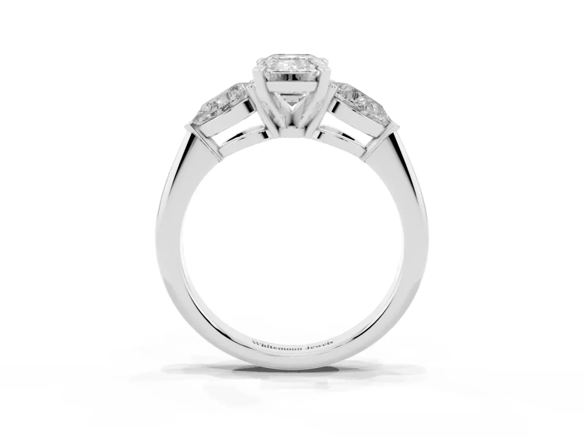 Three-Stone Emerald Cut Diamond Ring with Pear Side Stones and Four-Prong Setting Platinum
