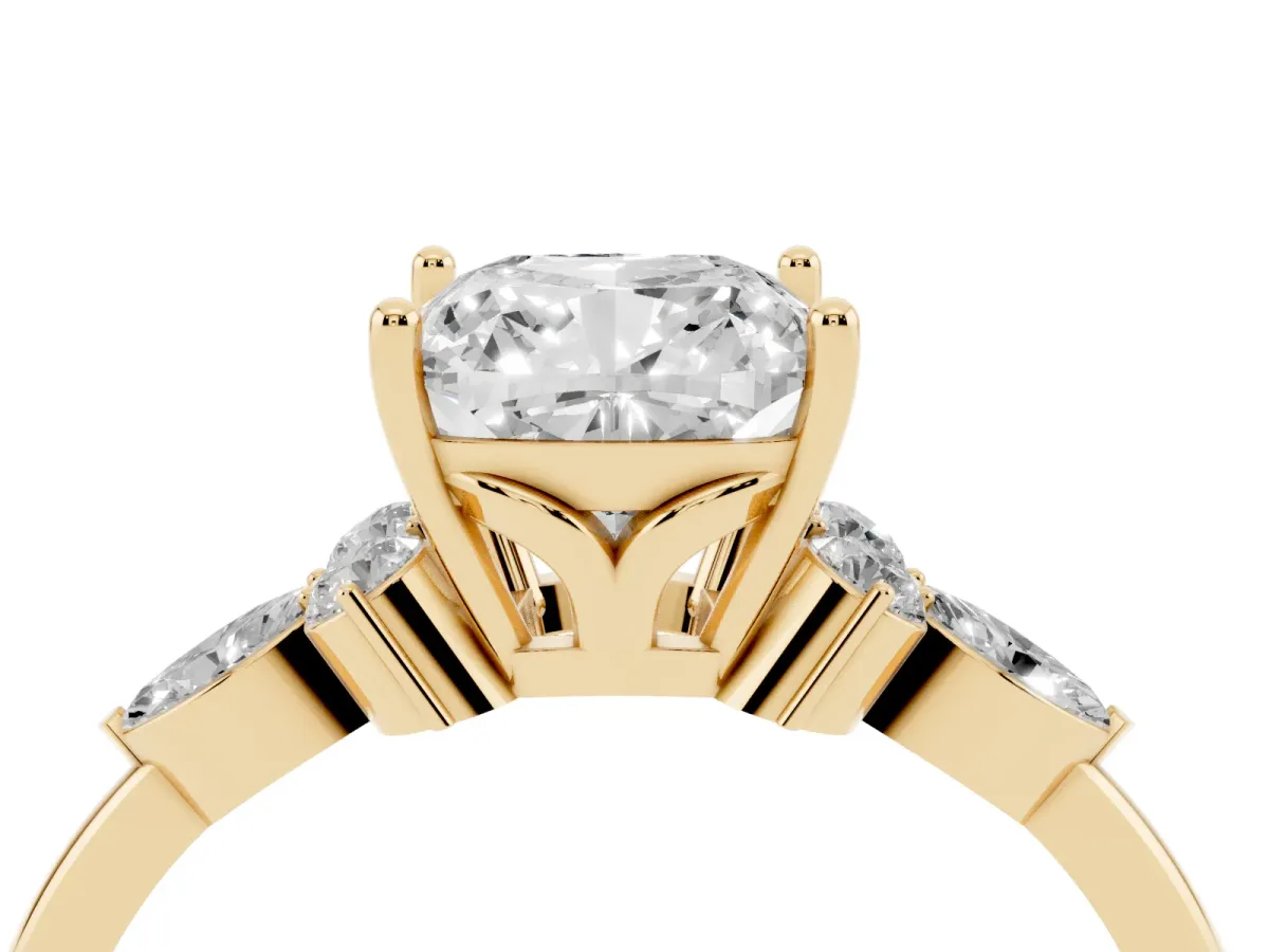 Cushion Cut Brilliant Diamond Solitaire Ring with Pear Side Stones and Four-Prong Setting Yellow gold