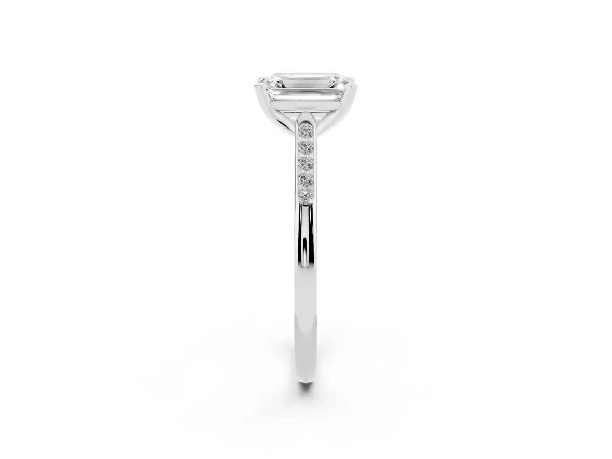Emerald Cut Diamond Solitaire Ring with Channel Set Round Band and Prong Setting White gold