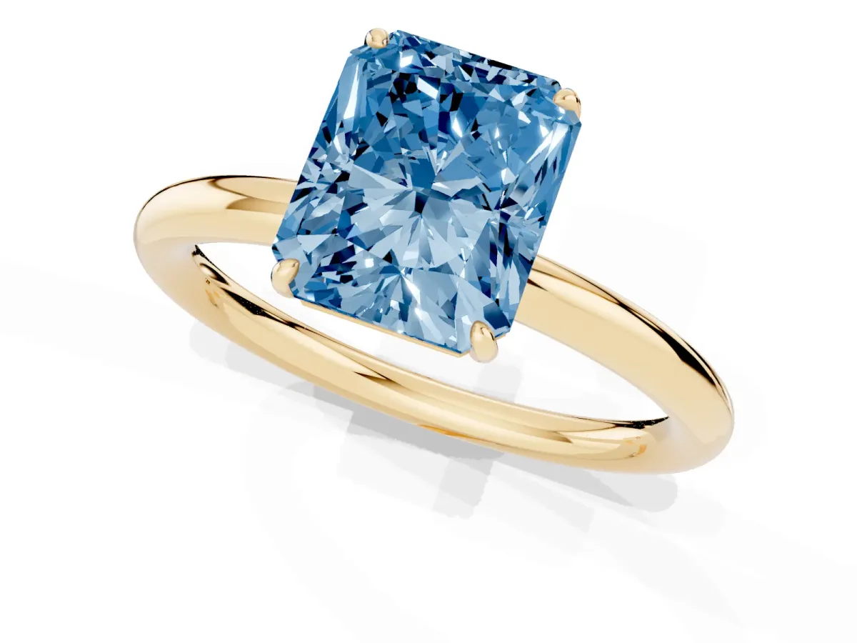 Fancy Blue Radiant Cut Solitaire Diamond Ring with Four-Prong Setting on a Plain Band Yellow gold