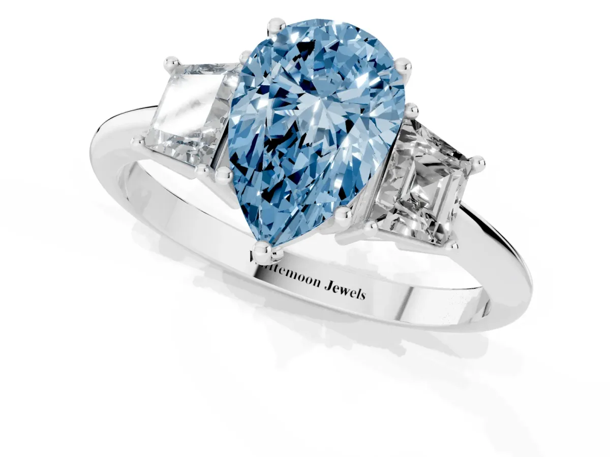 Fancy Blue Pear Cut Diamond Three-Stone Ring with Trapezoid Side Stones and Prong Setting Platinum
