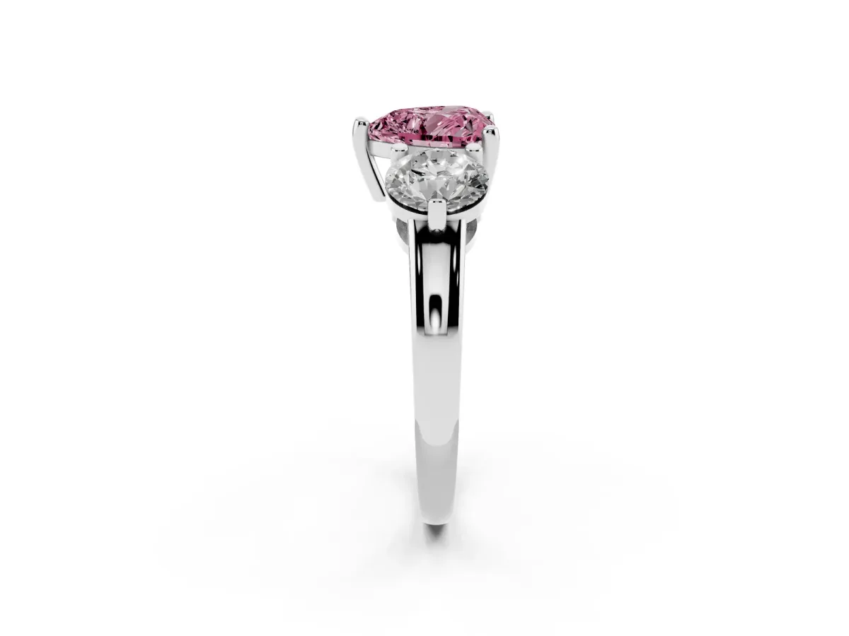 Fancy Pink Three-Stone Heart Cut Brilliant Cut Solitaire Ring with Prong Setting on a Classic Band White gold