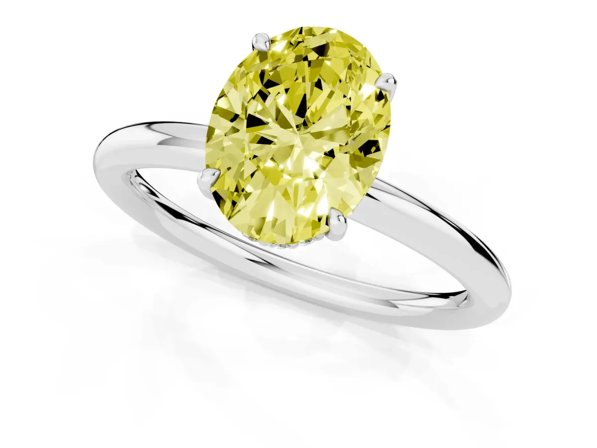 Fancy Yellow Oval Cut Diamond Solitaire Ring with Thin Band and Four-Prong Setting Silver