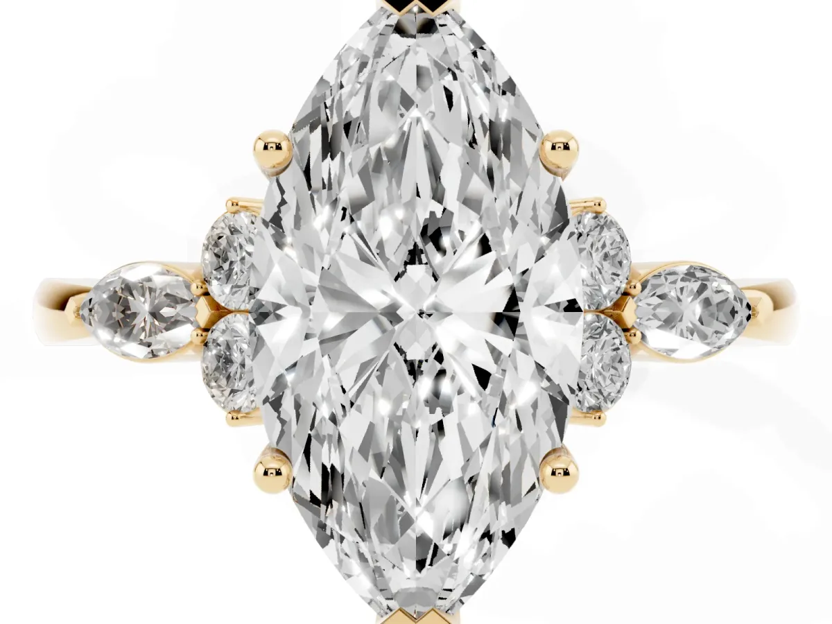 Marquise Cut Brilliant Diamond Solitaire Ring with Pear Side Stones and Four-Prong Setting Yellow gold