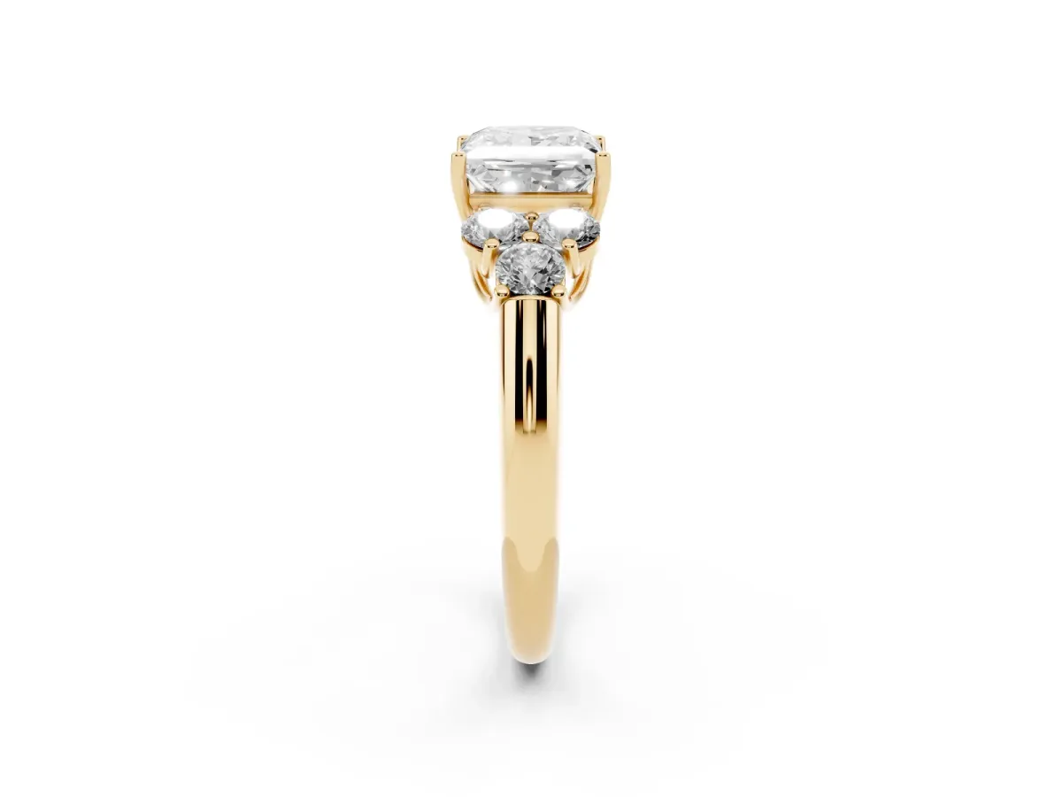 Princess Cut Cut Diamond Cluster Ring with Round Accent Stones and Prong Setting on a Classic Band Yellow gold