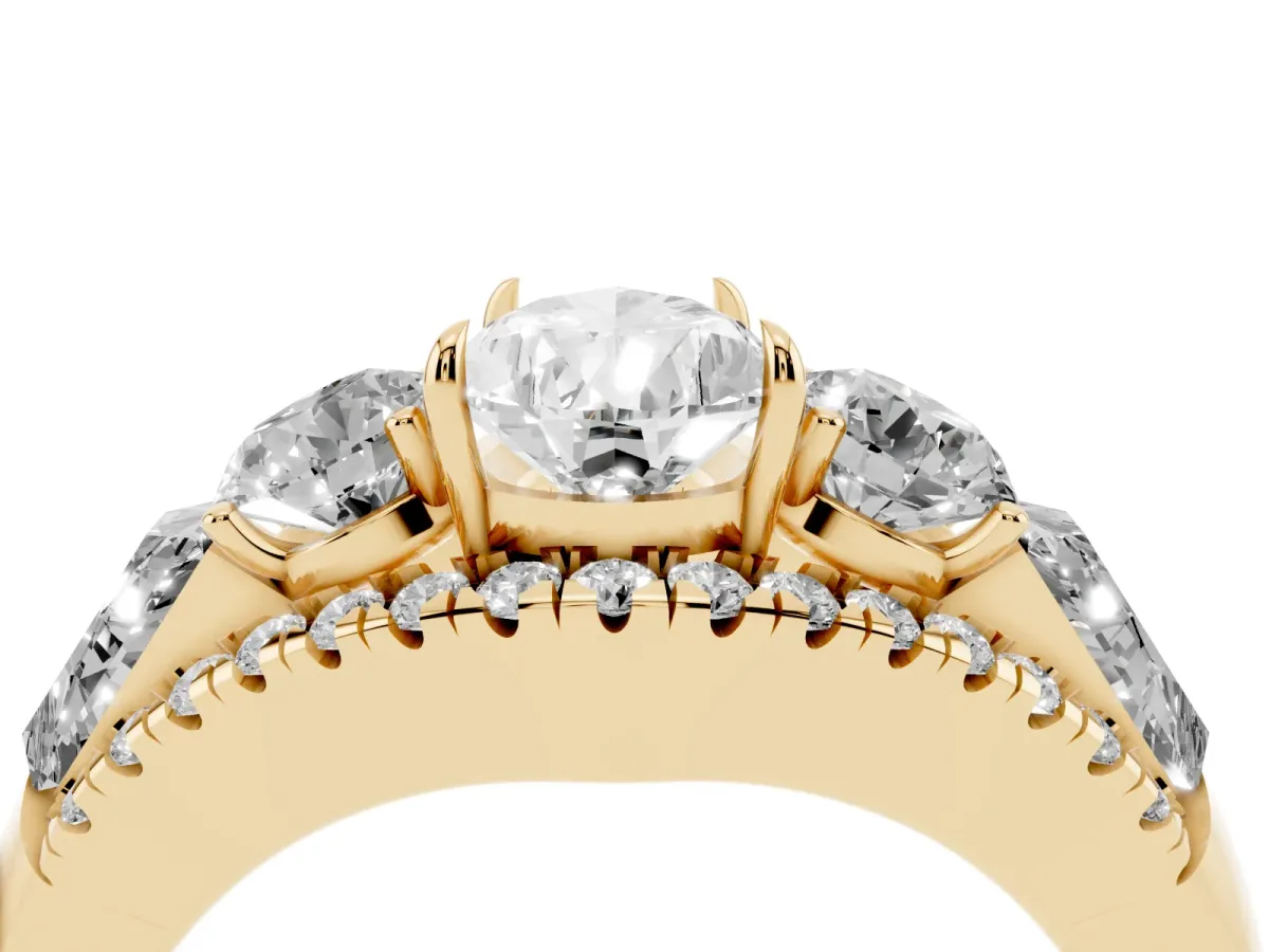 Three-Stone Pear Cut Diamond Engagement Ring with Pave Band and Prong Setting Yellow gold