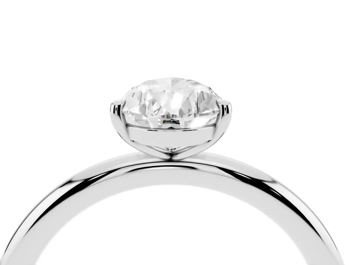 Pear Cut Solitaire Diamond Ring with Four-Prong Setting on a Plain Band Silver