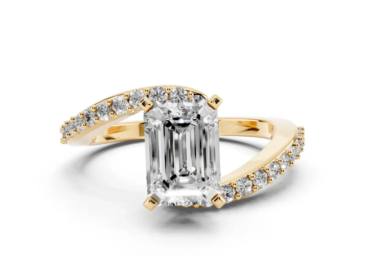 Emerald Cut Solitaire Twist Band with Pave Set Diamonds and Four-Prong Setting Yellow gold