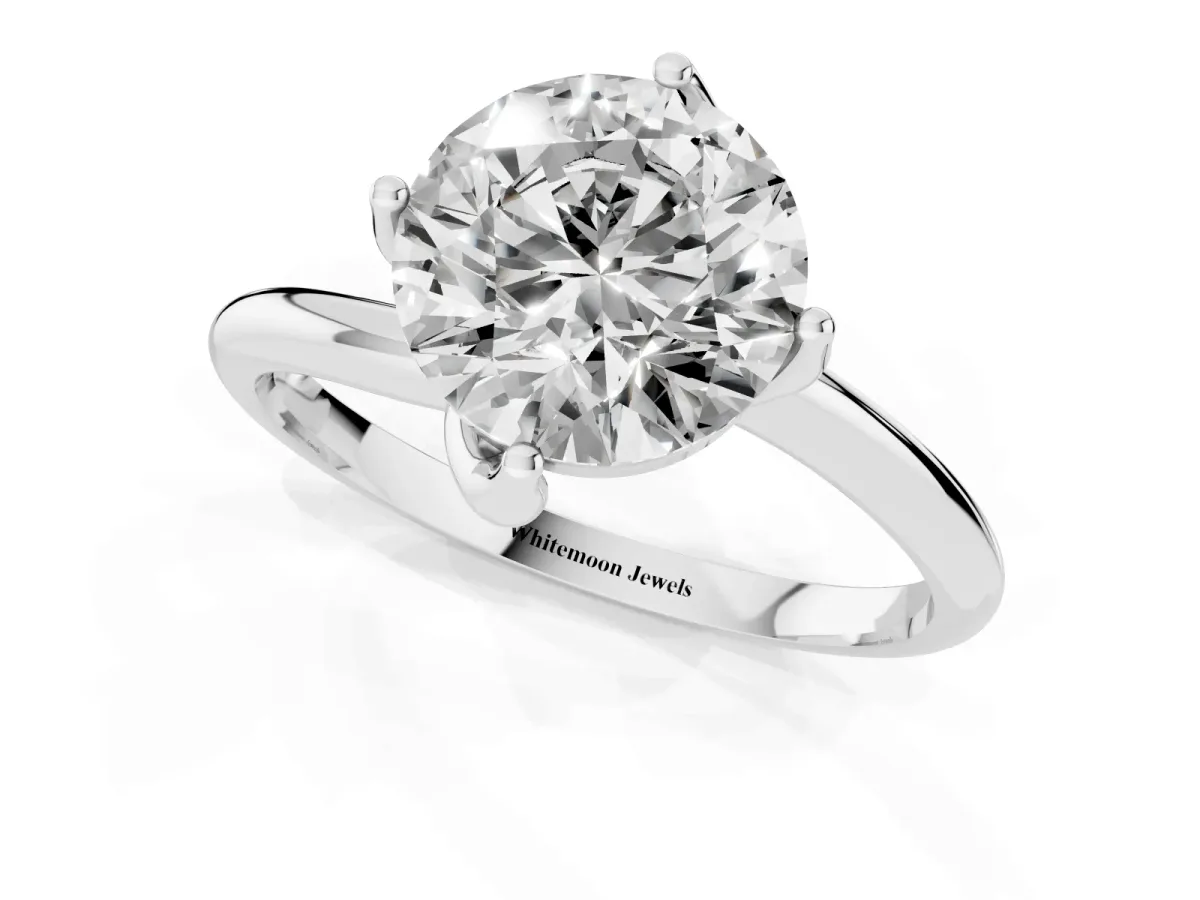 Round Cut Diamond Solitaire Engagement Ring with Four-Prong Setting and Classic Band Silver