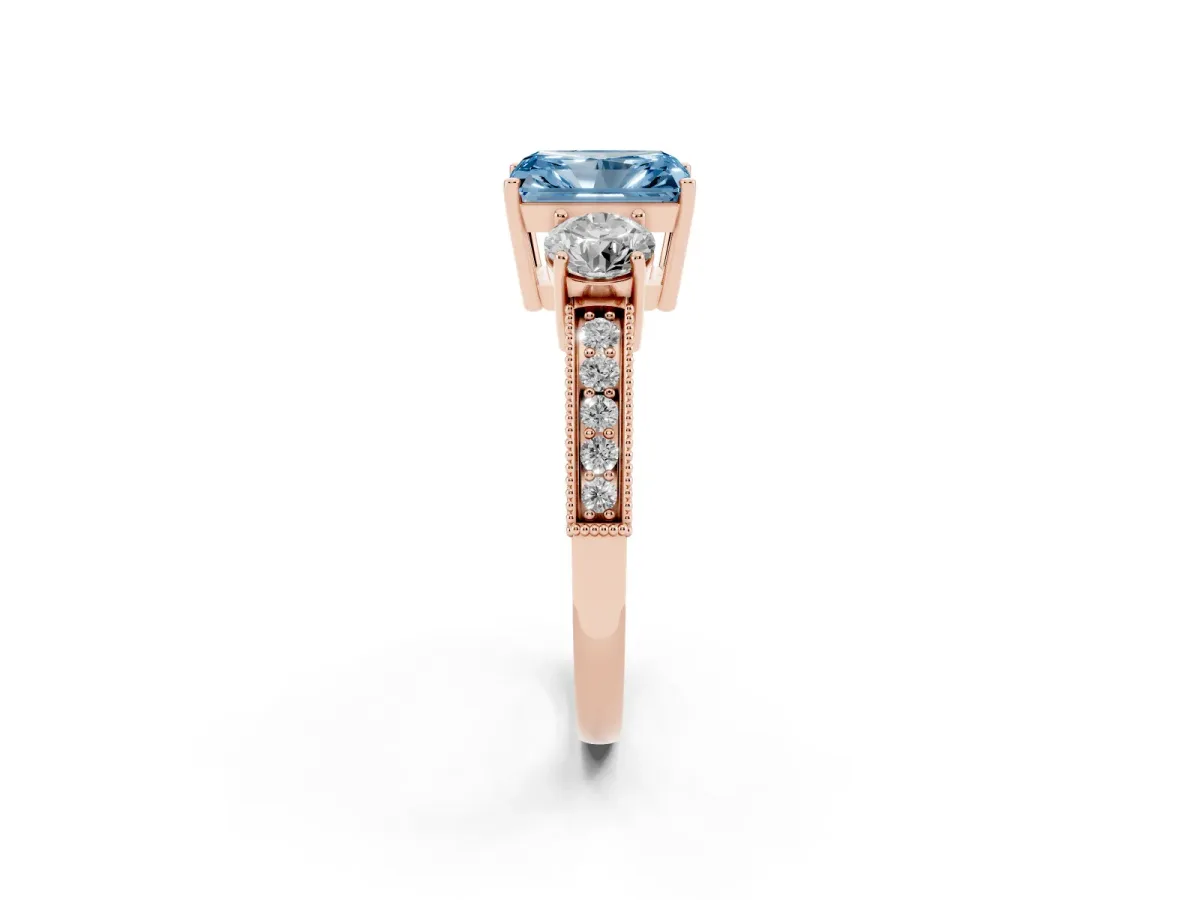 Fancy Blue Radiant Cut Three-Stone Diamond Ring with Pavé Band and Four-Prong Setting Rose gold