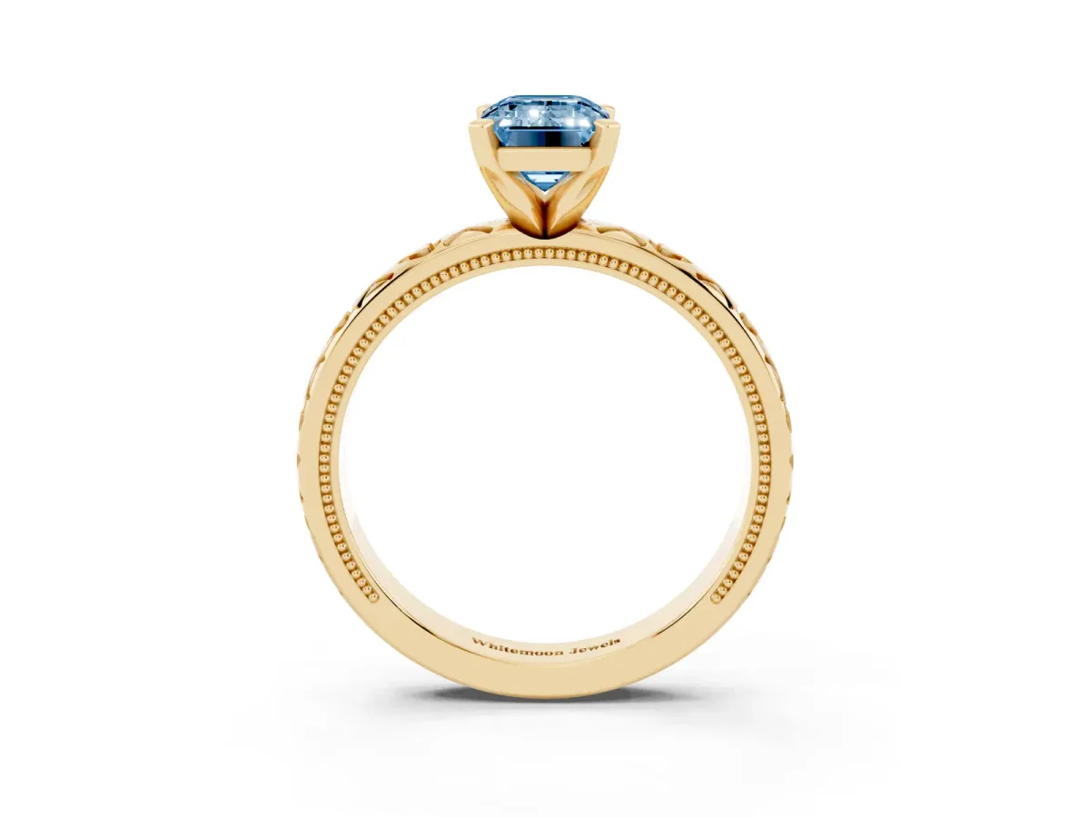 Fancy Blue Emerald Cut Solitaire Diamond Engagement Ring with XO Engraved Band and Four-Prong Setting Yellow gold