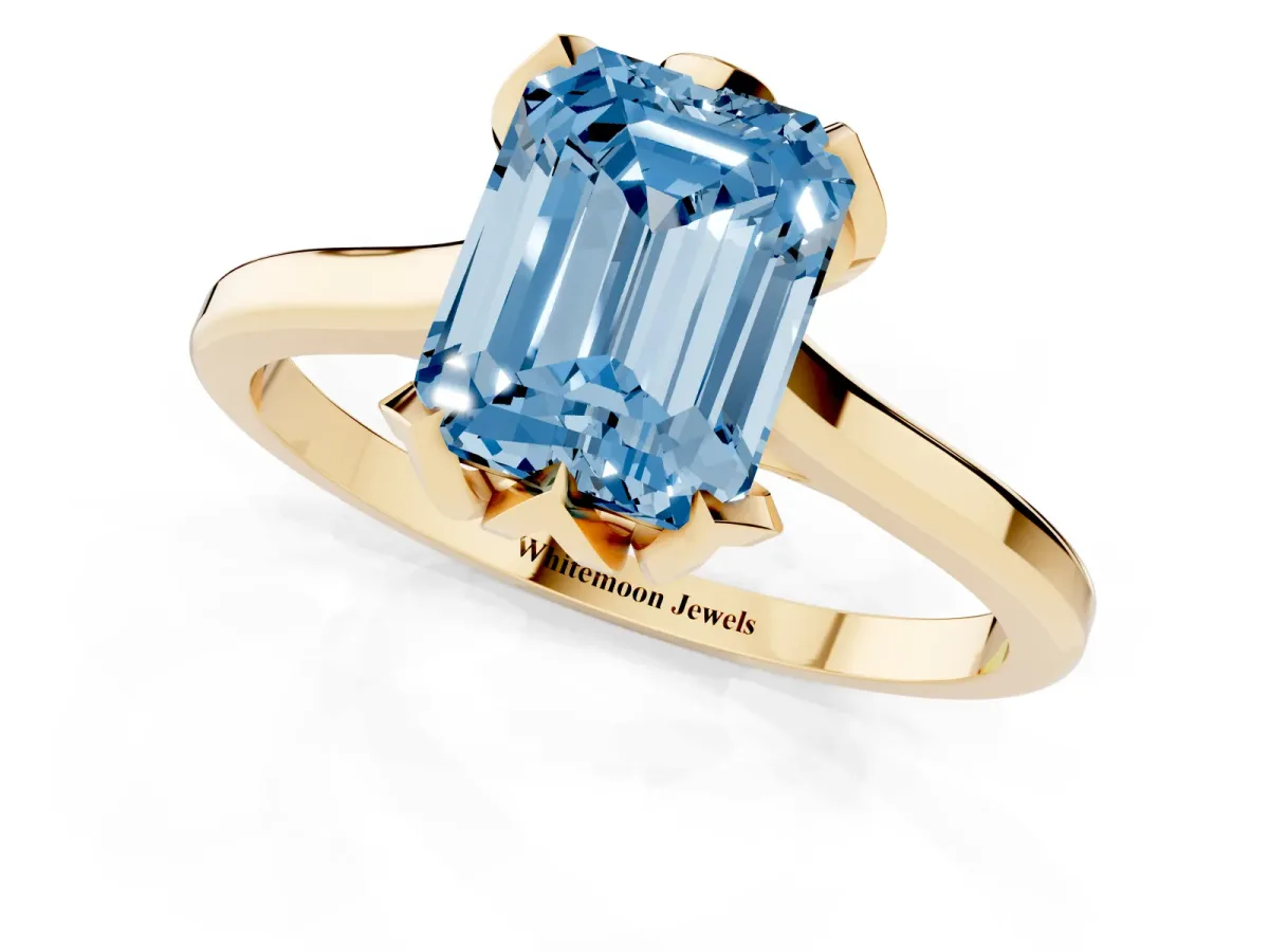 Fancy Blue Emerald Cut Diamond Solitaire Ring with Flower Prong Setting and Classic Band Yellow gold