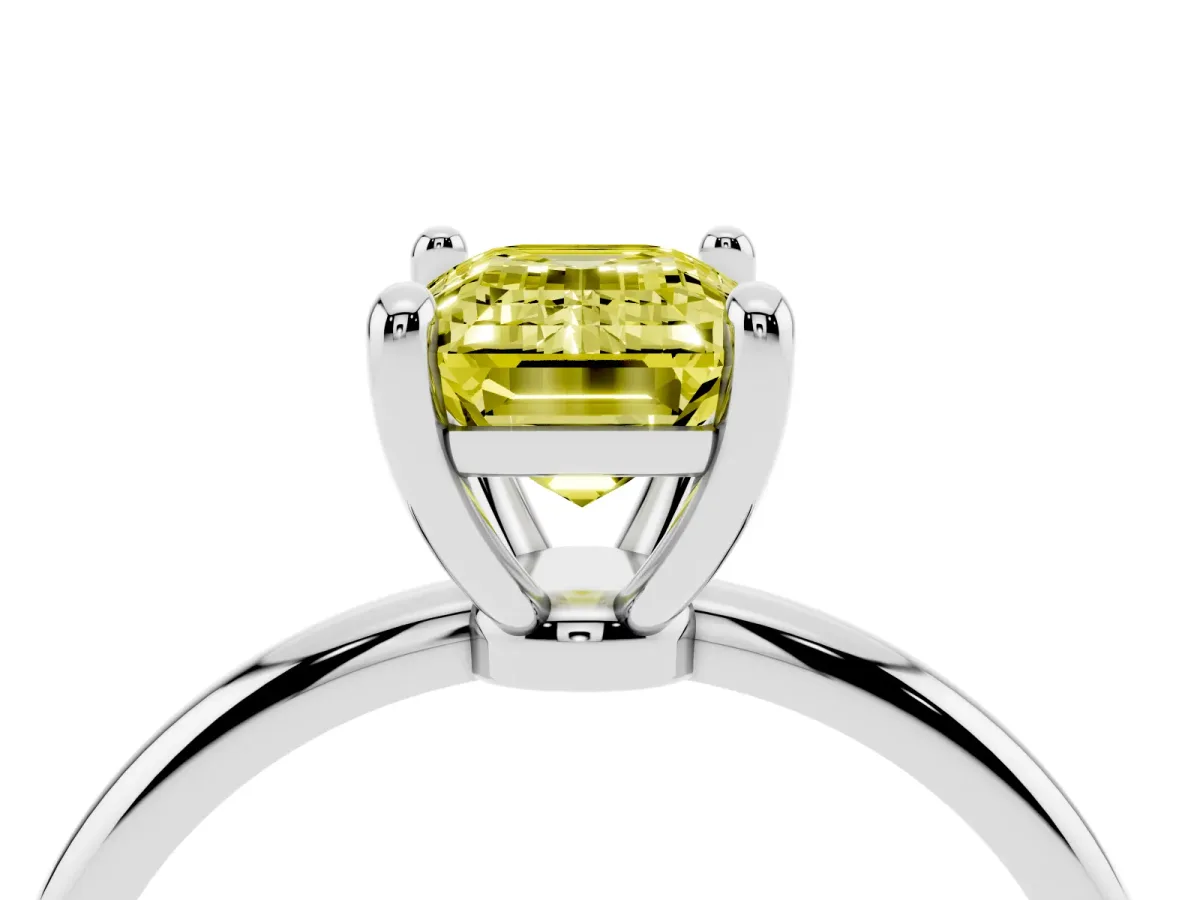 Fancy Yellow Emerald Cut Solitaire Diamond Ring with 4-Prong Setting on a Classic Band White gold