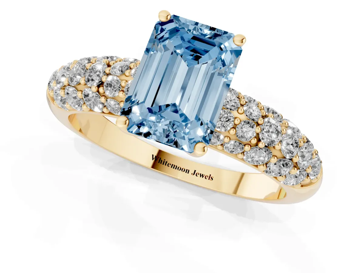 Fancy Blue Emerald Cut Diamond Pavé Band Solitaire Ring with Four-Prong Setting Yellow gold