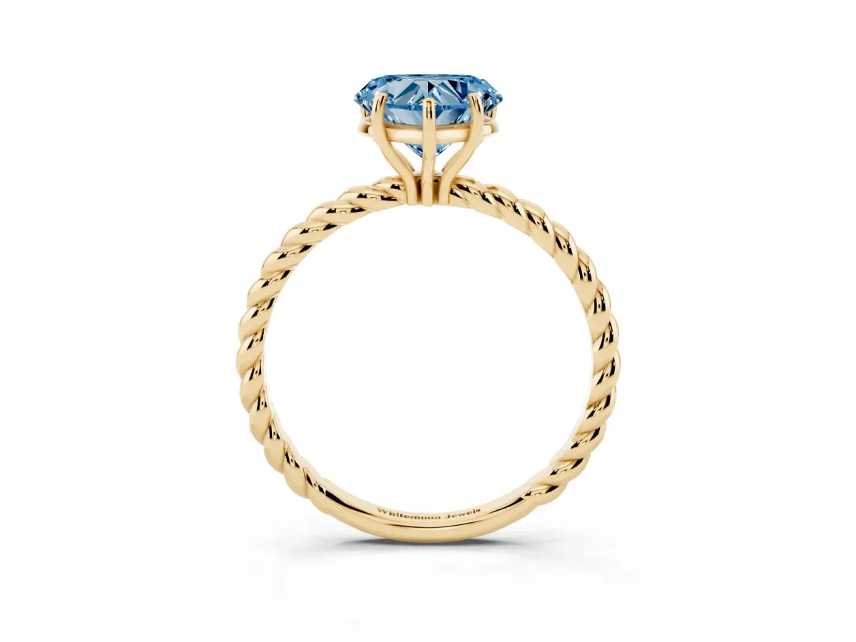 Fancy Blue Heart Cut Solitaire Twist Band Ring with Four-Prong Setting Yellow gold