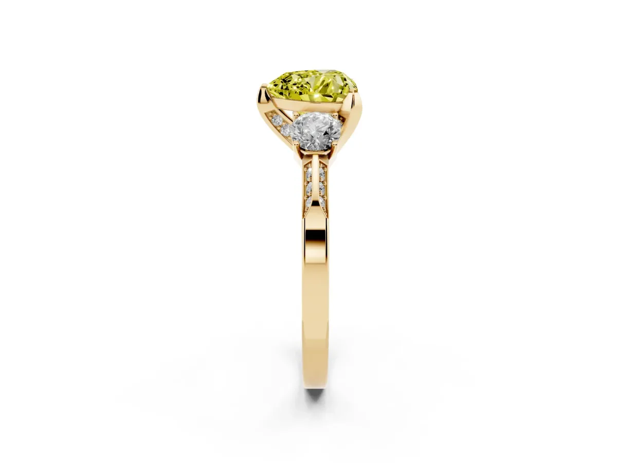 Fancy Yellow Heart Cut Brilliant Three-Stone Diamond Ring with Pavé Band and Four-Prong Setting Yellow gold