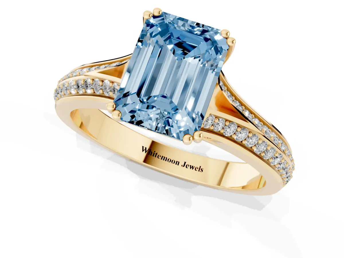 Fancy Blue Emerald Cut Diamond Split Shank Engagement Ring with Pavé Band Yellow gold