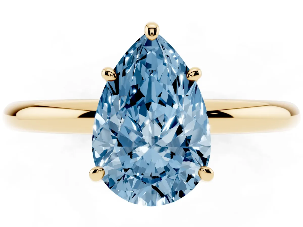 Fancy Blue Pear Cut Solitaire Diamond Ring with Four-Prong Setting on a Plain Band Yellow gold