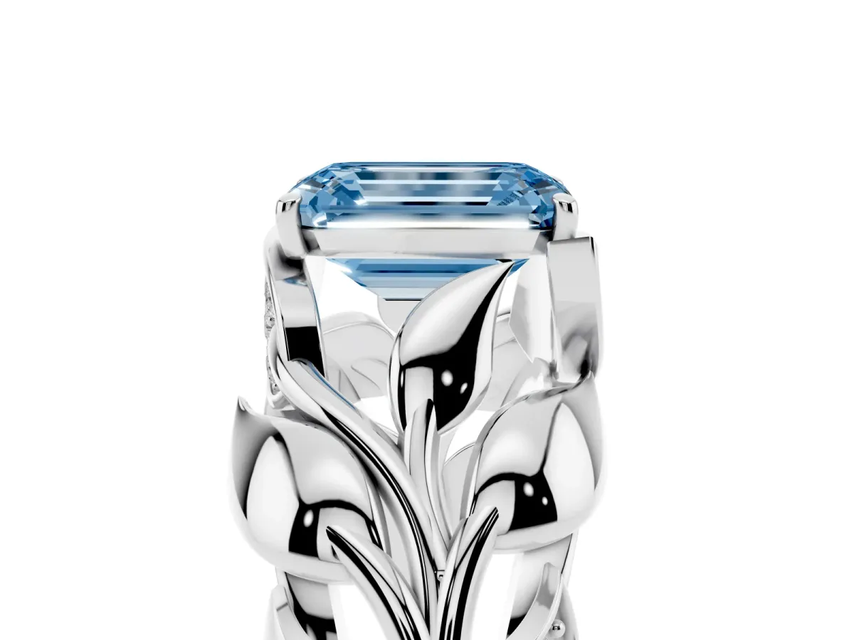 Fancy Blue Emerald Cut Diamond Leaf-Inspired Engagement Ring with Round Accents and Prong Setting Silver