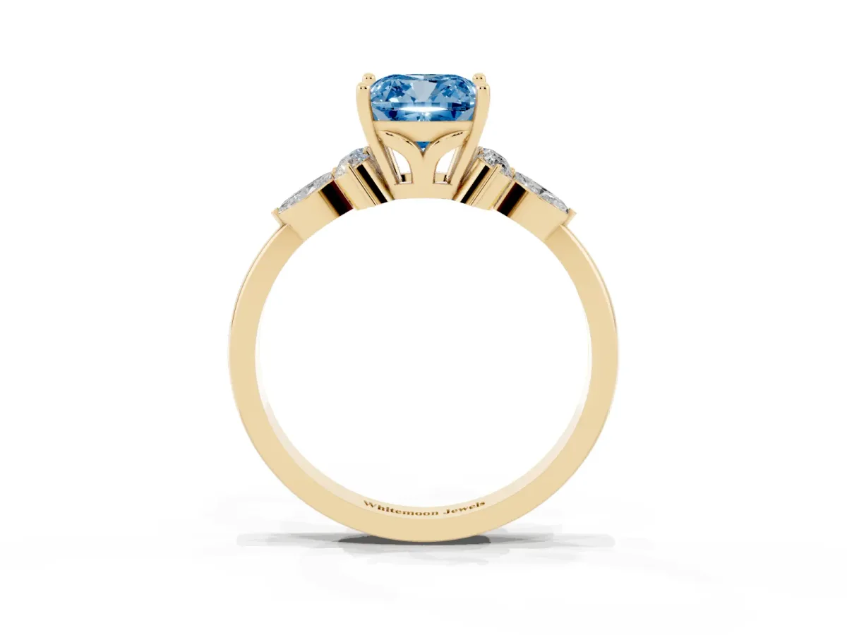 Fancy Blue Cushion Cut Brilliant Diamond Solitaire Ring with Pear Side Stones and Four-Prong Setting Yellow gold