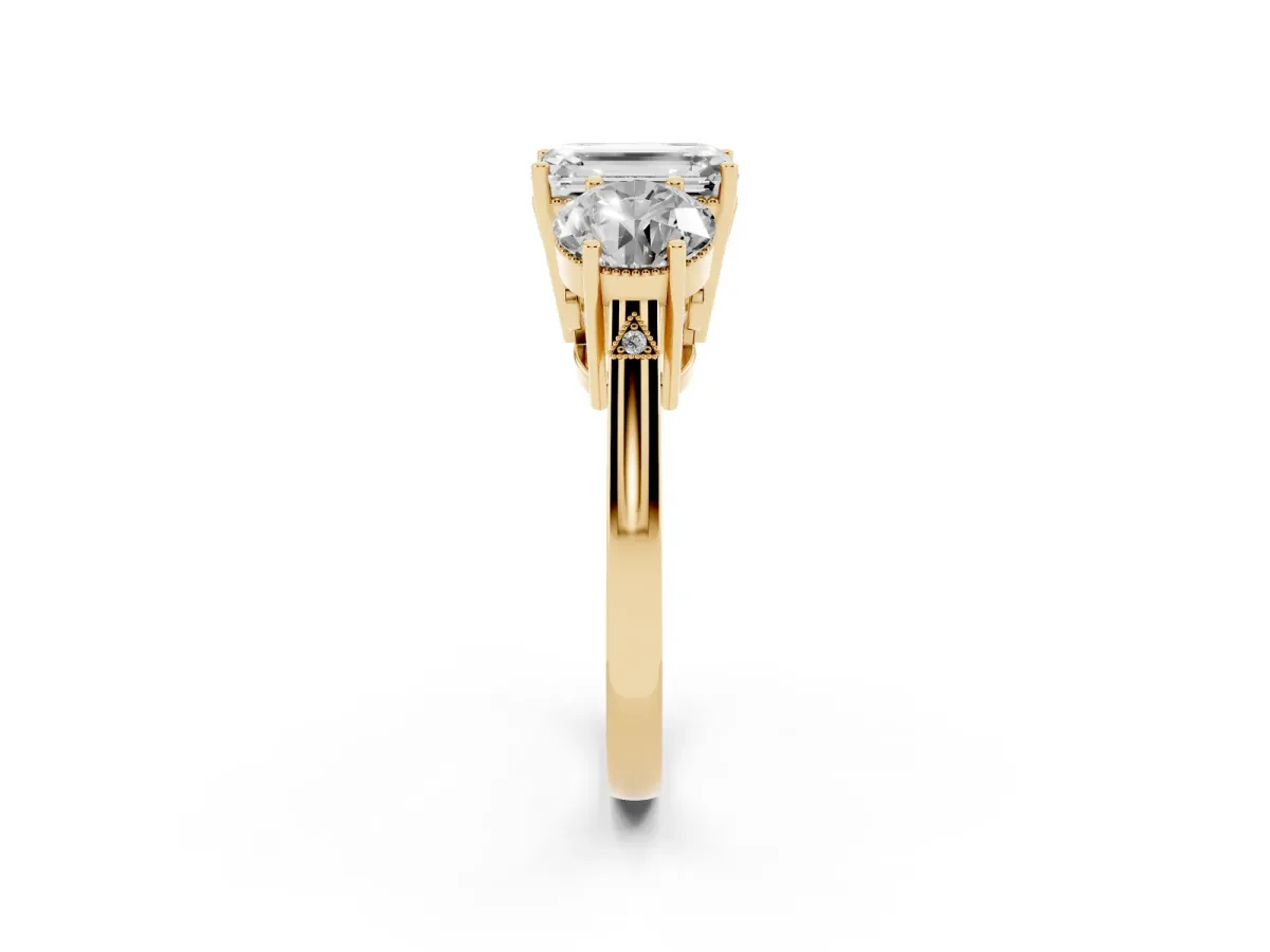 Three-Stone Emerald Cut Diamond Engagement Ring with Prong Setting on a Classic Band Yellow gold