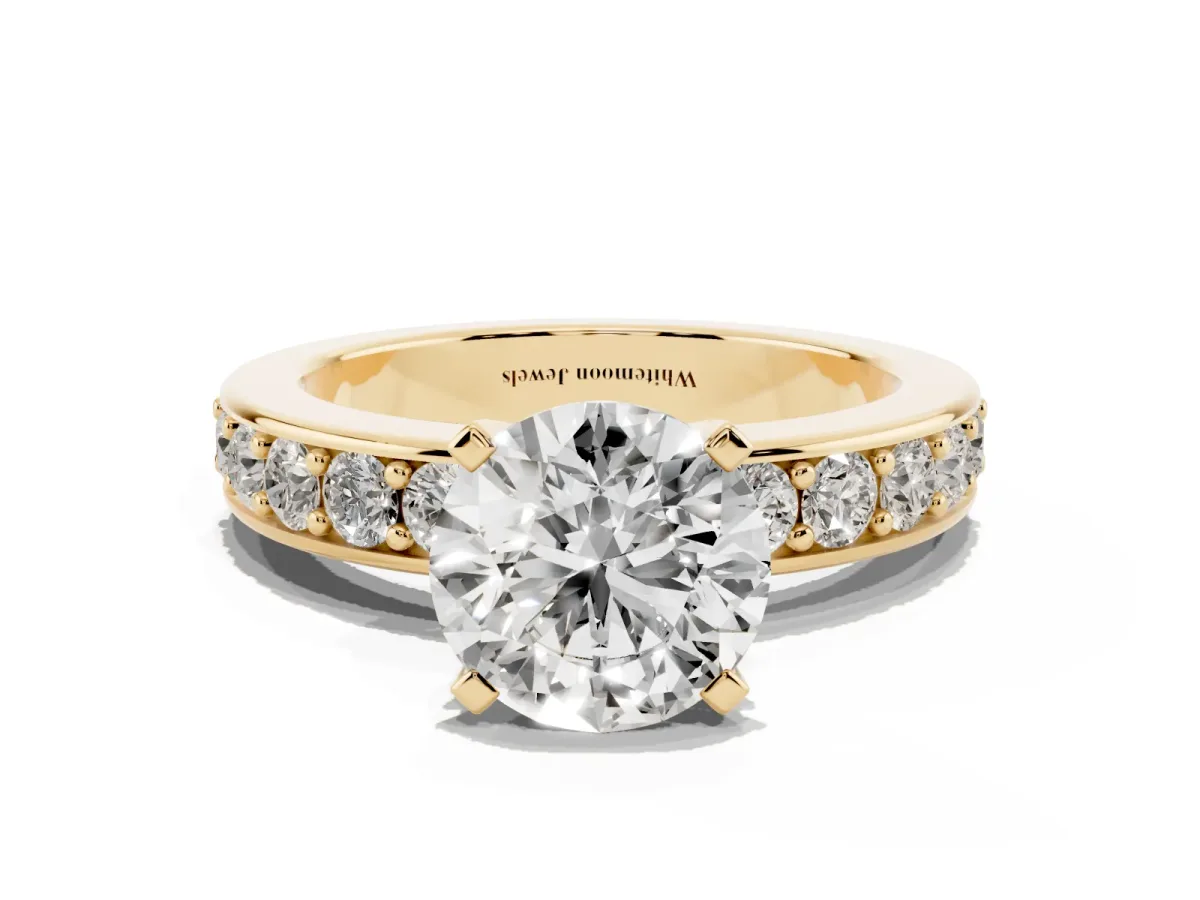 Round Cut Diamond Engagement Ring with Channel Set Round Band and Prong Setting Yellow gold