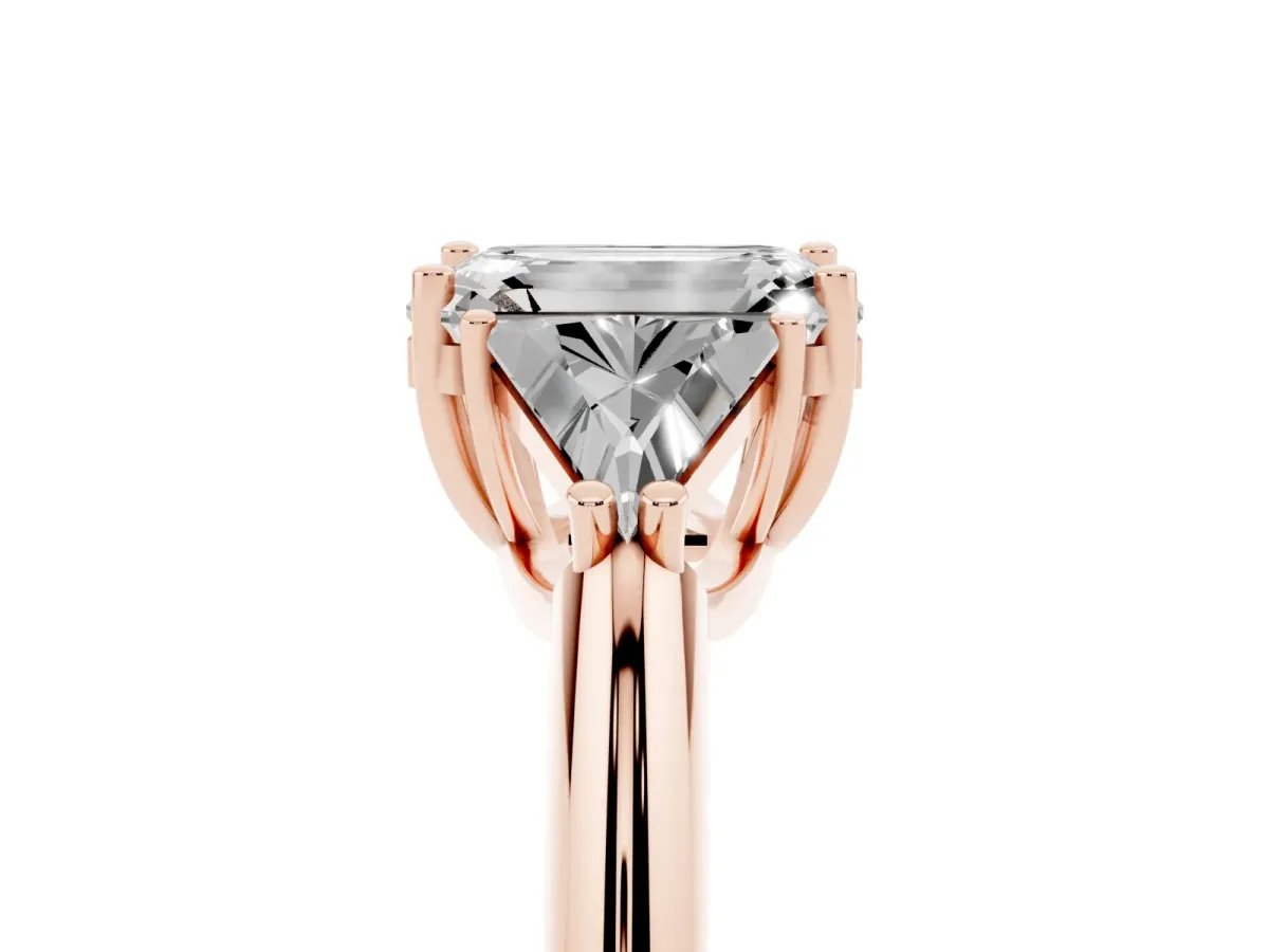 Three-Stone Emerald Cut Diamond Engagement Ring with Trillion Side Stones and Prong Setting Rose gold