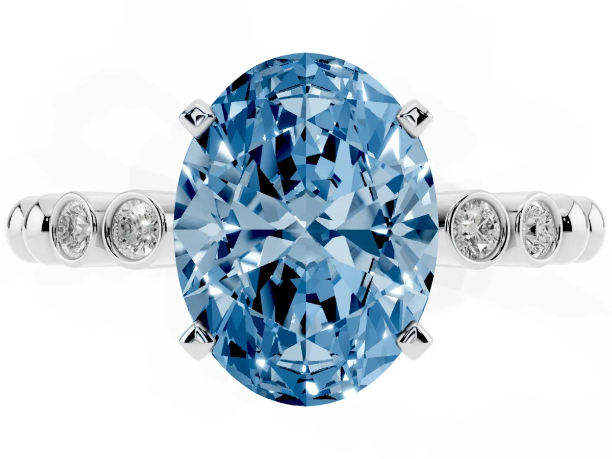 Fancy Blue Oval Cut Solitaire Bezel Accent Diamond Engagement Ring with Beaded Band and Four-Prong Setting White gold