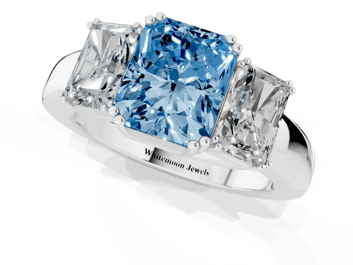Fancy Blue Three-Stone Radiant Cut Cut Diamond Ring with Channel Set Band and Four-Prong Setting Silver