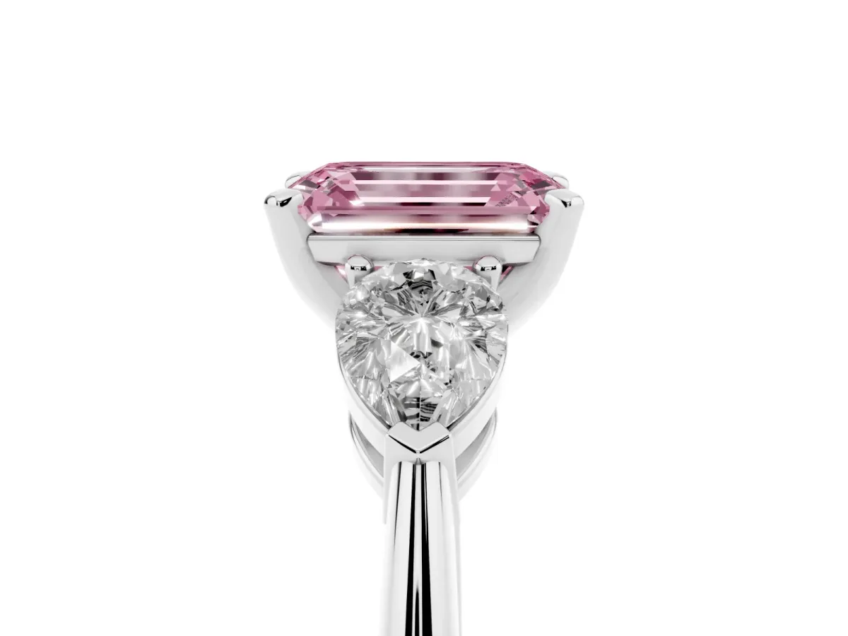 Fancy Pink Three-Stone Emerald Cut Diamond Ring with Pear Side Stones and Four-Prong Setting Silver