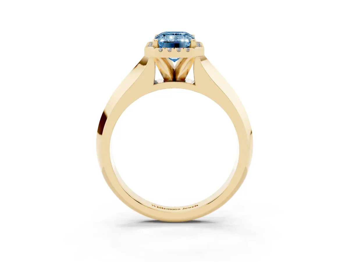 Fancy Blue Emerald Cut Halo Diamond Ring with Cathedral Band and Four-Prong Setting Yellow gold