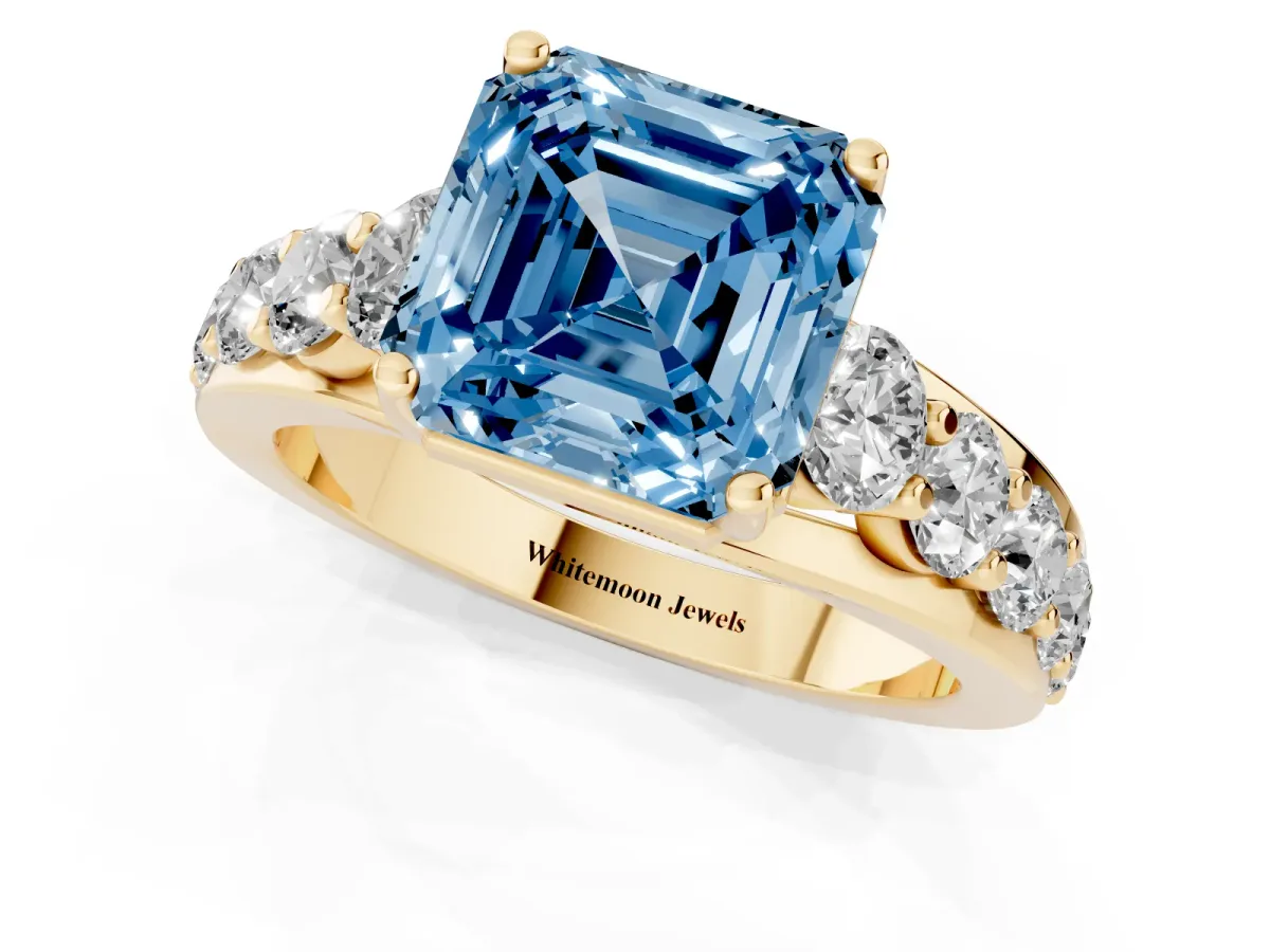 Fancy Blue Asscher Cut Diamond Engagement Ring with Pavé Band and Four-Prong Setting Yellow gold